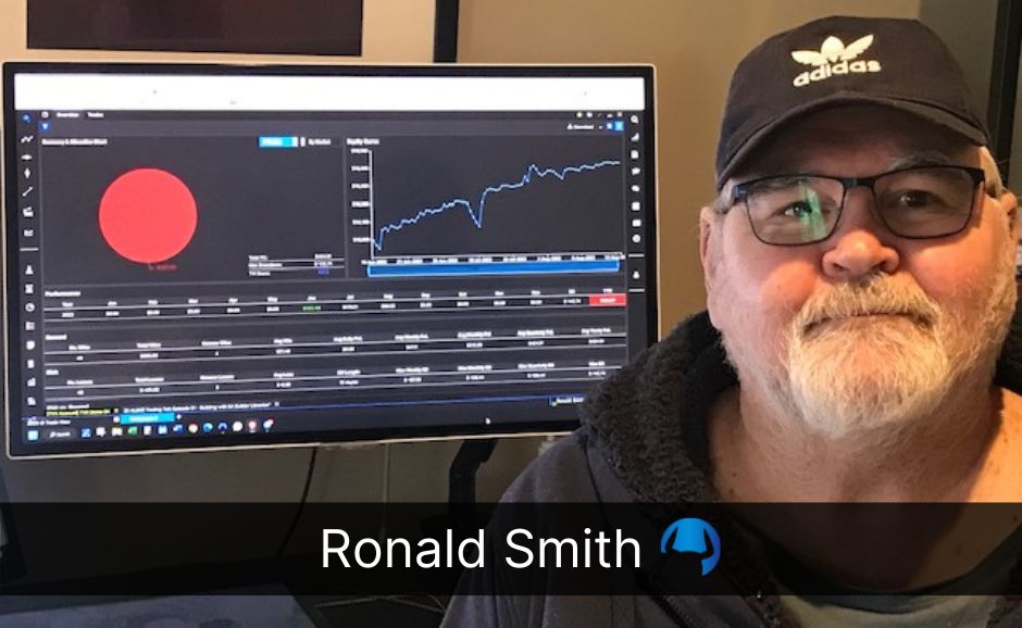 Image of Ronald Smith in front of computer screen showing trades he is currently driving in Demo